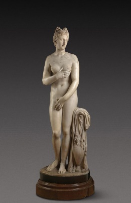 A marble sculpture featuring a nude womanDescription automatically generated with medium confidence
