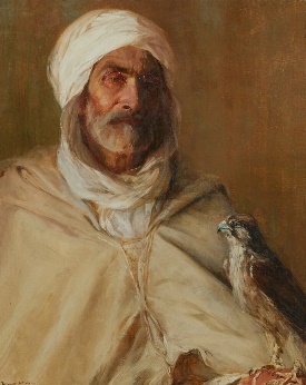 An Middle Eastern man with a falconDescription automatically generated with medium confidence
