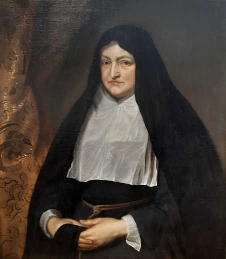 Portrait of an old woman wearing a black dress and shawl