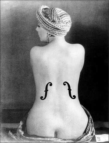 a nude woman from behind with violin 'Fs' on her back.Description automatically generated